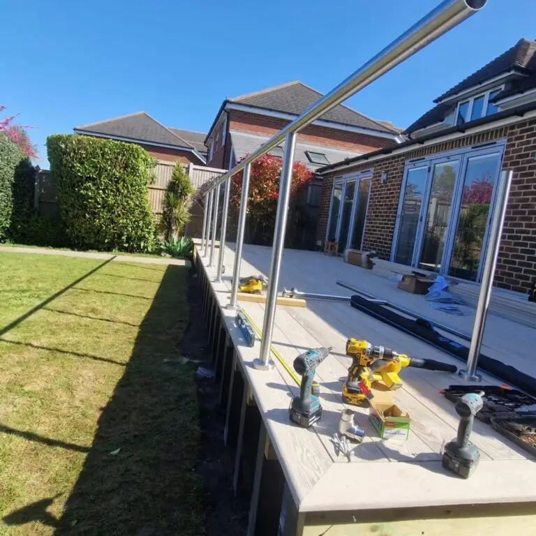 Wide-angle view of composite decking installation showing full deck area with uniform board placement and edge detailing