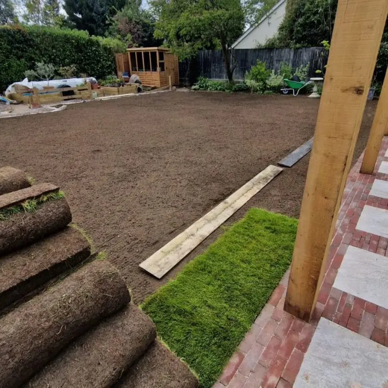 Rolls of premium turf stacked on site, showing preparation stage of a lawn installation in Bearsted.